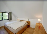 Thatched roof meets modernity, lake view; sauna, garden and much more...