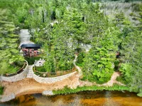 Near Pictured Rocks and trails, On the Au Train River, has private hot tub