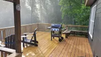 Cozy cool cabin in the mountains with a view Close to Downtown with a hot tub
