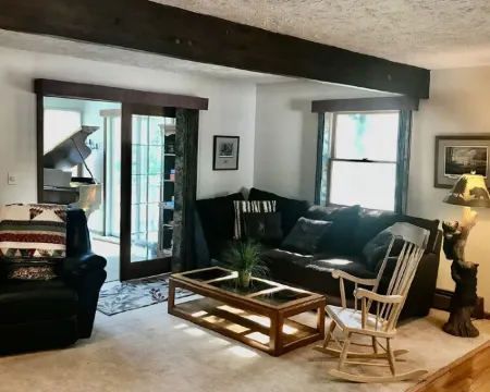 The Gray Escape Steps away from Lake Margrethe Hotels in Grayling Township