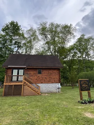 Newly Renovated Log Cabin located on the Greenbrier River in Hinton WV