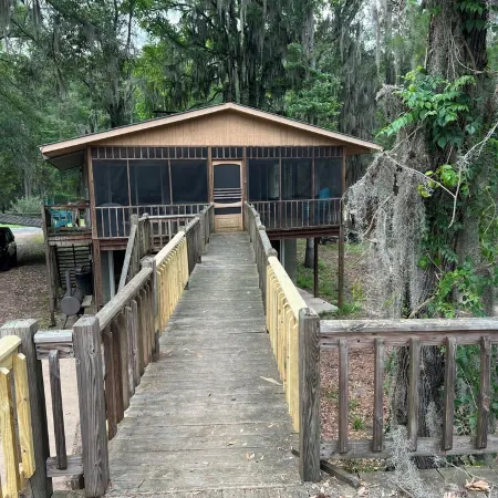 Two Story House with Deck over the River
