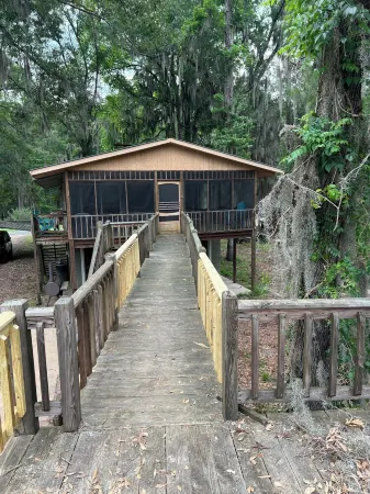 Two Story House with Deck over the River