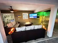 Tropical Oasis sleeps 13 with a heated pool.  Free WiFi.  Close to everything