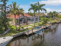 MAGNIFICENT! LUXURY WATERFRONT HOME;BIG HEATED POOL-80’ DOCK! 5 MIN FISH VILLAGE