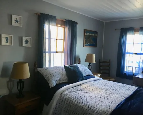 2 bedroom  1 bath, large deck and dock, on the water in peaceful cove,   Year Hotels in Boothbay