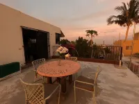Large house on a hill with a spectacular view over the sea and mountains