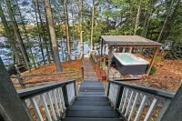 Lakefront retreat 30 min to Traverse City. Hot tub, fire pit, kayaks, game room.