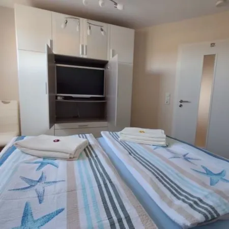Modern 70 m² Vacation Rental with a Rooftop Terrace in Grömitz / Brenkenhagen and a Wallbox