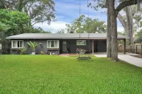Mid-Century Boho Chic home with Pool, Game Room & Outdoor Playhouse.
