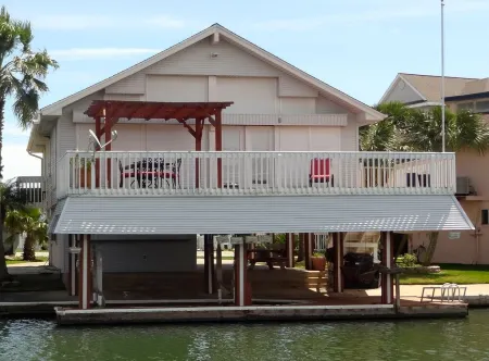 ENJOY FISHING, SWIMMING OR JUST RELAXING AT THIS JAMAICA BEACH CANAL PROPERTY
