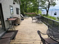 Waterfront retreat on 7 private wooded acres with beautiful sunset views.
