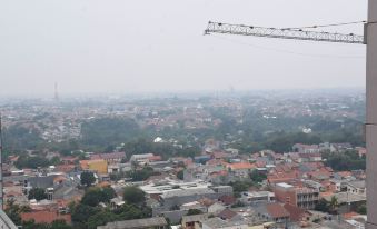 Homey and Tidy Studio Taman Melati Margonda Apartment Near Campus