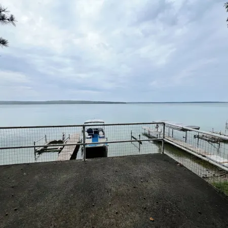 Charming 2-bedroom cabin sits on 2.5 acres on Hubbard Lake.