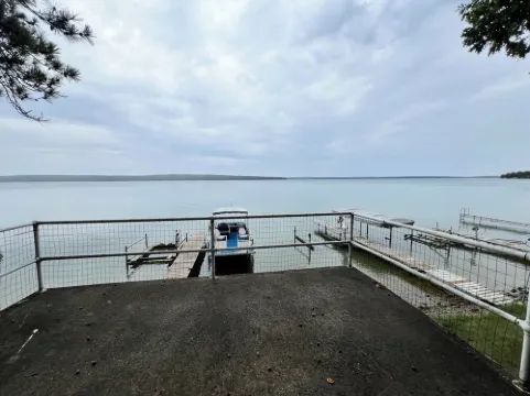 Charming 2-bedroom cabin sits on 2.5 acres on Hubbard Lake.