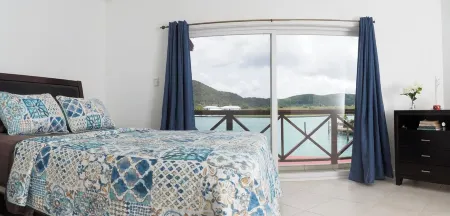Charming 2-bedroom villa 238D South Finger Jolly Harbour with spectacular view.