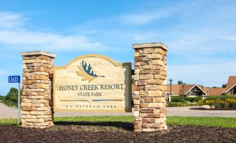 "a large wooden sign with the words "" honey creek resort state park "" written on it" at Honey Creek Resort