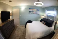 Unique waterfront home, Hot Tub, private boat dock,  walk to beach, pet friendly