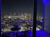 Downtown Luxury High-Rise Retreat: Panoramic City Views & Modern Amenities