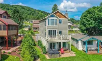 Lake Front Home w/ Hot Tub, Fire pit, yard, walk to Wisp Resort,Tubing Hill View