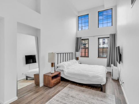 Soaring Ceilings and Chef's Kitchen - Stylish Urban Oasis