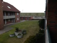 Apartment directly on the beach in Norddeich Parking lot at the house