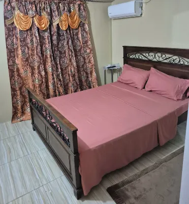 Cozy 3-bedroom townhome in enjoyable Piarco with AC, WiFi Hotels in Piarco