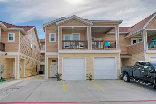 Private Yard Cornhole Resort Pool Oasis w Slide down the Shore by AvantStay