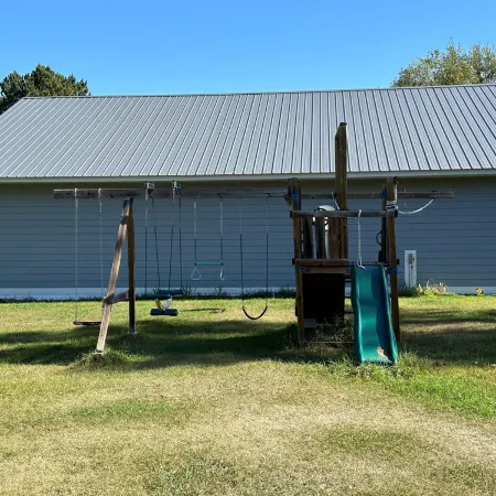 BEAUTIFUL lake front home with a private beach, dock and large yard