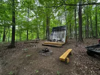 Charming A-frame cabin set in the woods overlooking deep wooded ravines.