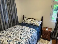 Cozy 2-bedroom house among the trees With WiFi and AC, Close to a Beach Hotel a