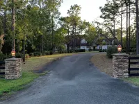 Escape to this serene 4-bedroom home set on 10 private acres.