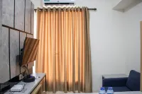 Comfort 2BR at 28th Floor Podomoro Golf View Apartment By Travelio