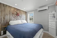 Modern Beachfront Escape Steps from Ferry Private Deck Waterfront Hotel a 