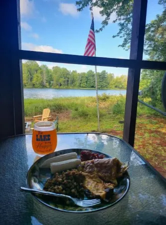 Relaxing rustic cabin on the lake 25 feet from the shore.