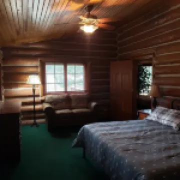Two story authentic log construction home, built in 1936 with two fireplaces.