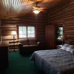 Two story authentic log construction home, built in 1936 with two fireplaces.