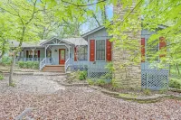 Enjoy 1.3 wooded acres and location to amenities Holly Lake has to offer.