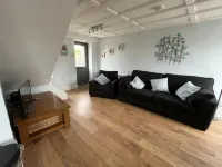 Barn conversion overlooking the golf course to the sea