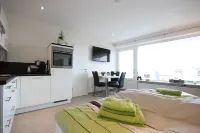 Absolute top location with sea view, balcony, W-Lan, top equipped