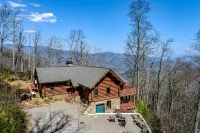 Mountain-view log home with hot tub, firepits, pool table & air hockey
