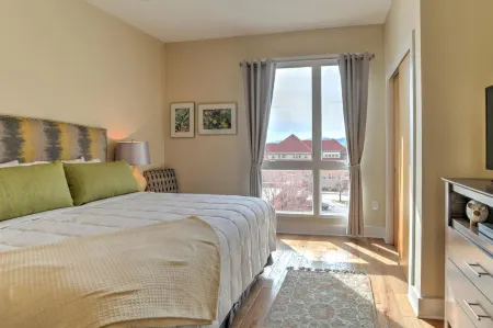 Charming Condo with Balcony and Parking - Modern City Oasis