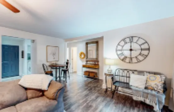 Deluxe condo with a screened patio, electric fireplace, pools, tennis, & gym