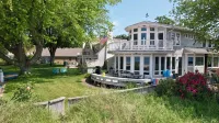 Beachfront Home on Lake Michigan beach. Spectacular sunsets, walk to downtown.