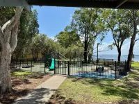 Large Lakefront House on Lake Macquarie with Kayaks, Kids Toys and Dog Door Hotels in Caves Beach