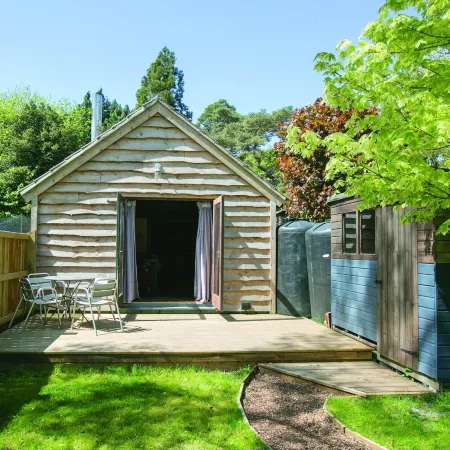 Idyllic Log Cabin with Log-fired Hot Tub nestled in a Forest Clearing