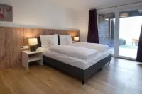 Ski & Golf Suites Zell am See by Alpin Rentals - Incl Summercard فنادق في Bruck an der GroBglocknerstraBe