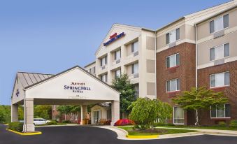 "a large hotel with a white sign that says "" the richard hotel "" is shown" at SpringHill Suites Herndon Reston