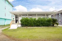 Classic Beach Cottage with front porch view of water