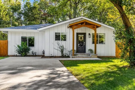 White Guesthouse with a Pool